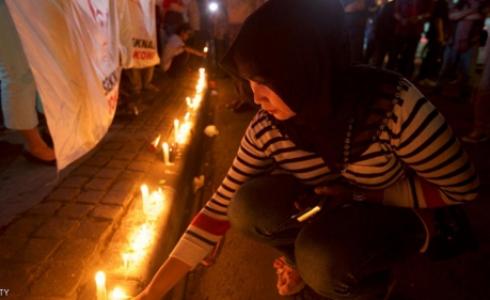 اشعال الشموع على اروح القتلى