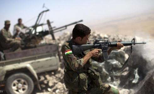 مقاتل كردي في جبهة قتال ضد داعش شرق الموصل