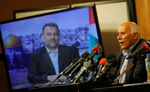 جانب من المؤتمر الذي جمع العاروري والرجوب