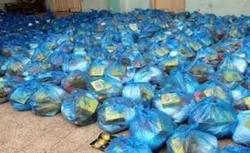 تكية دورا" توزع وجبات غذائية لأفراد الأمن ولجان الطوارئ