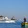 زوارق الاحتلال مع قارب صيد فلسطيني في عرض البحر - أرشيف
