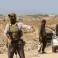 نازحون فلسطينيون يعبرون نقطة تفتيش يديرها عناصر أمن أمريكيين ومصريين في محور نتساريم - توضيحية